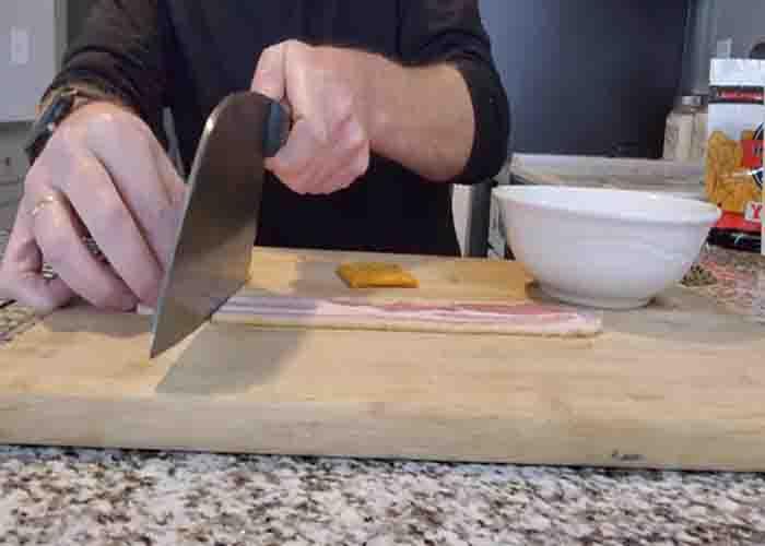 Chopping the bacon for the candied bacon crackers recipe