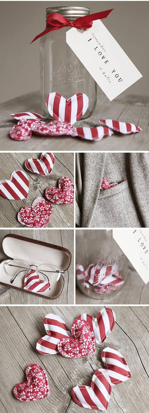 Clear mason jar filled with small stuffed fabric hearts in mixed pink and red prints on a shelf idea for February 14
