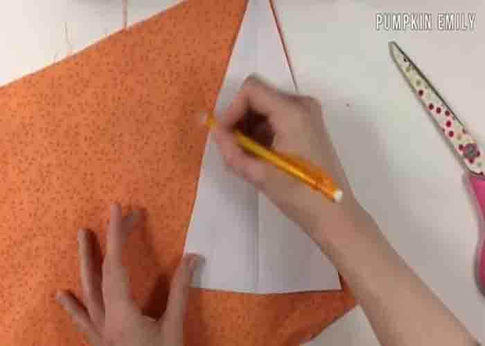 Tracing the triangle to make the fabric carrots