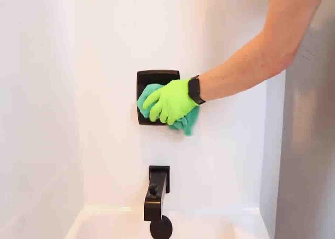 Wiping down the entire shower from top to bottom