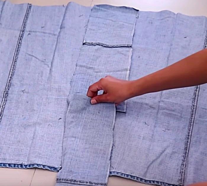 Make a long denim woman's vest out of a large pair of men's jeans