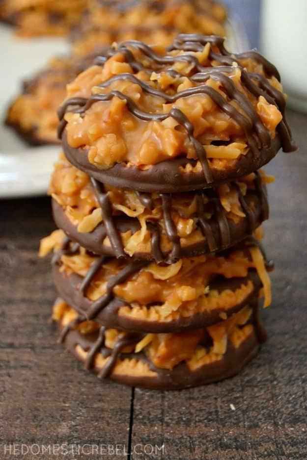 No bake samoa cookies, caramel and toasted coconut topped shortbread rounds stacked with chocolate drizzle