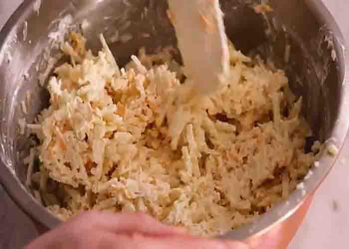 Mixing the hashbrown casserole ingredients