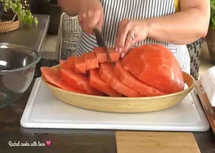 Chopping the watermelon for the agua fresca drink recipe