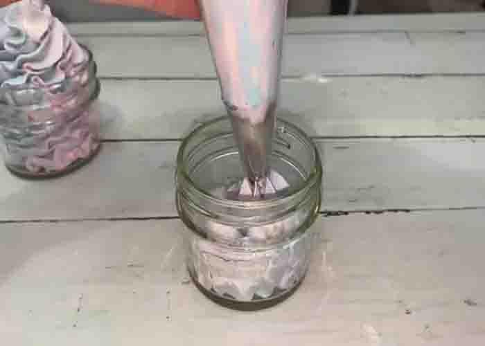 Piping the whipped soap to the prepared container