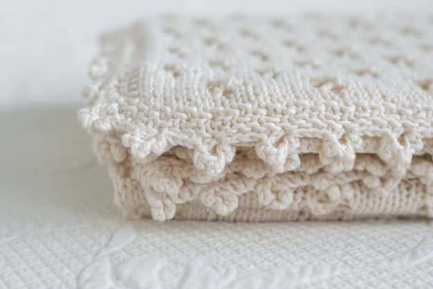Knit Baby Blanket with Cloverleaf Eyelet Stitch, a handmade nursery piece, short enough on steps to wrap up before supper