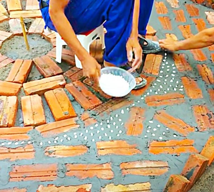Use concrete and bricks to build this work of art in the yard or garden