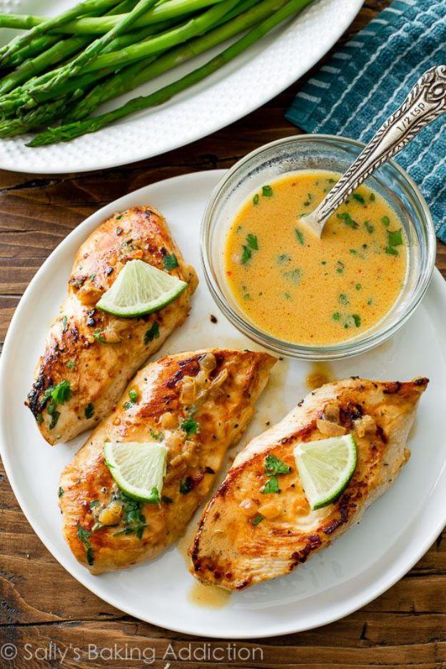 Skillet chicken with creamy cilantro lime sauce, three chicken cutlets on a plate with lime wedges and sauce
