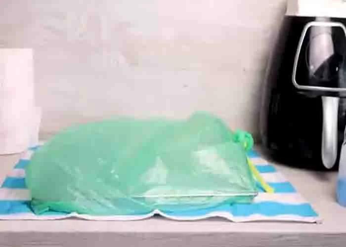 Soaking the oven racks inside a plastic bag