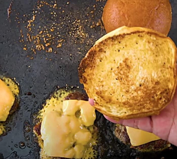 Grill buns with garlic butter for an In-N-Out copycat burger