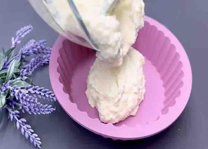 Adding the cheesecake mixture onto the baking mold