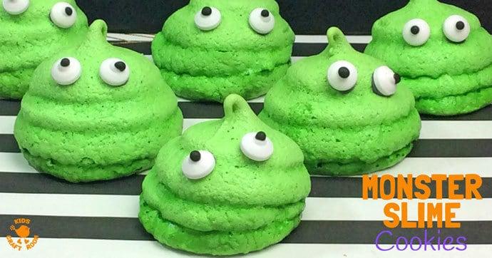 Green monster slime meringue cookies piped into irregular shapes and finished with assorted candy eyes for Halloween