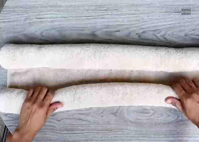 Rolling the bath towel to make a teddy bear