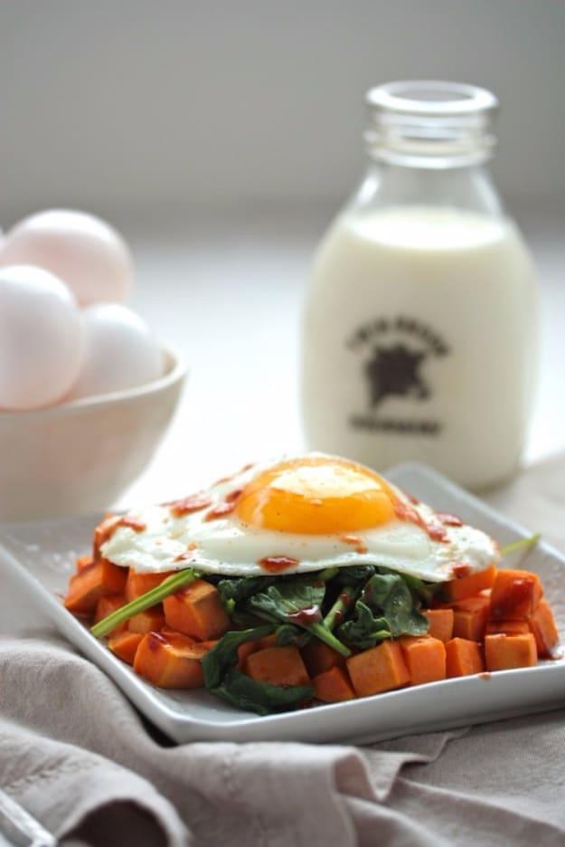 Sweet potato and spinach breakfast hash with a fried egg on top, a budget friendly 3 ingredient meal
