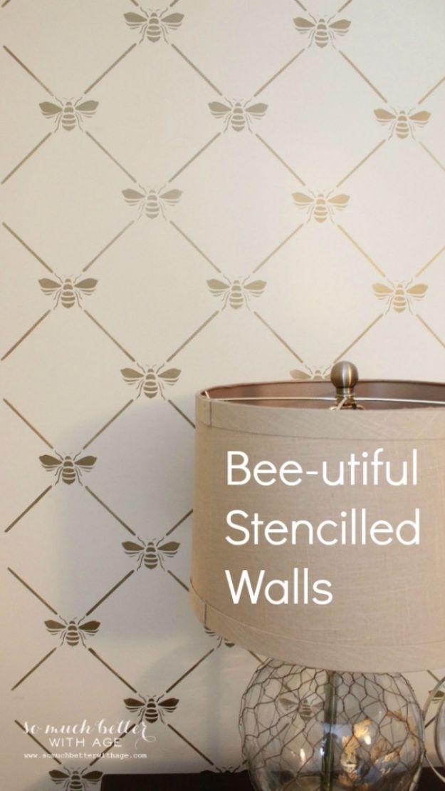 Bee-utiful stencilled walls graphic with a gold trellis and bees behind a lamp with a white drum shade