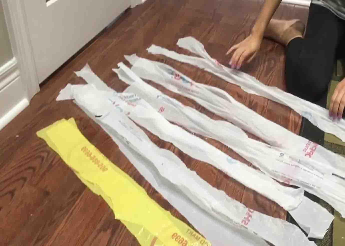 Cutting the plastic bag into strips