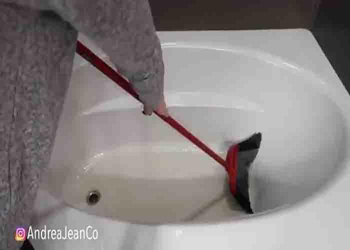 Sweeping the dirt off the bathtub