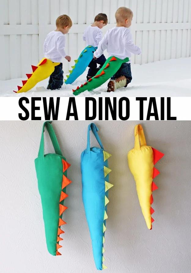 Sewing projects for boys dino tails in green, blue and yellow with felt spikes, hung on a wall and worn by three children