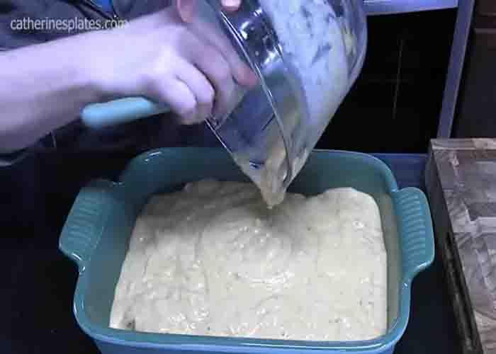 Adding the cream of soup mix over the chicken