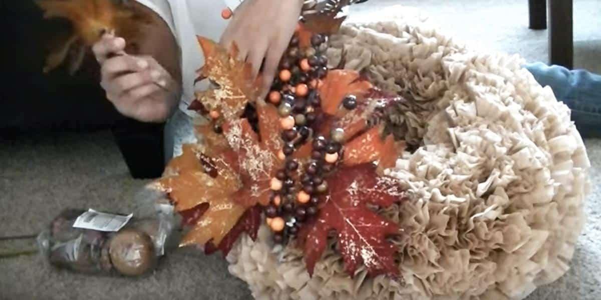 Coffee filter wreath with the filters dyed and fluffed into paper flowers, a cheap fall wreath for a door
