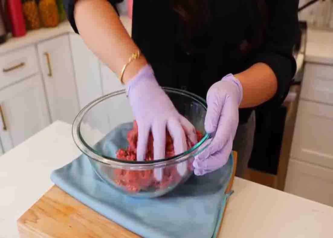 Seasoning the ground beef for the ground beef and cabbage recipe
