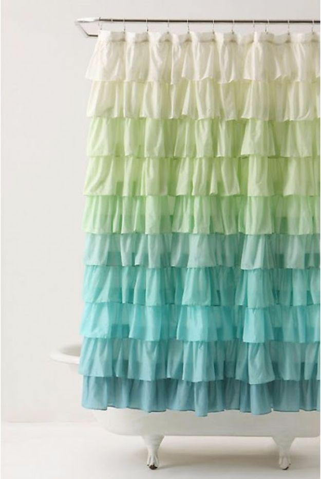 Ruffle shower curtain, an ombre home sewing project with rows of cream green and teal ruffles beside a clawfoot tub