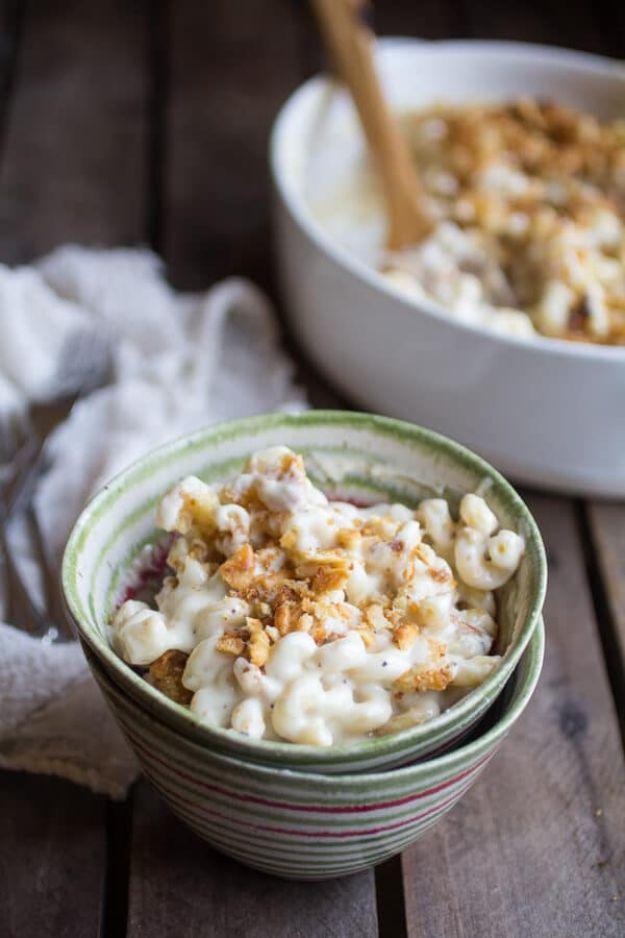 Creamy brie four cheese mac and cheese served in a stacked bowl with a buttery toasted Ritz cracker topping