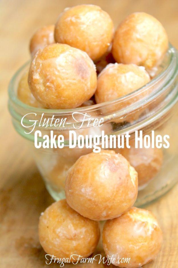 Gluten free cake doughnut holes dipped in a sweet vanilla sugar glaze, draining on a wire rack to set