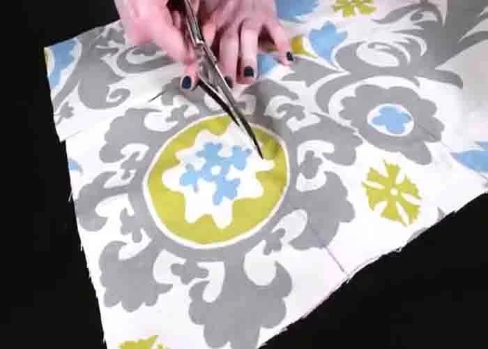 Cutting the fabric to make a tab top curtain
