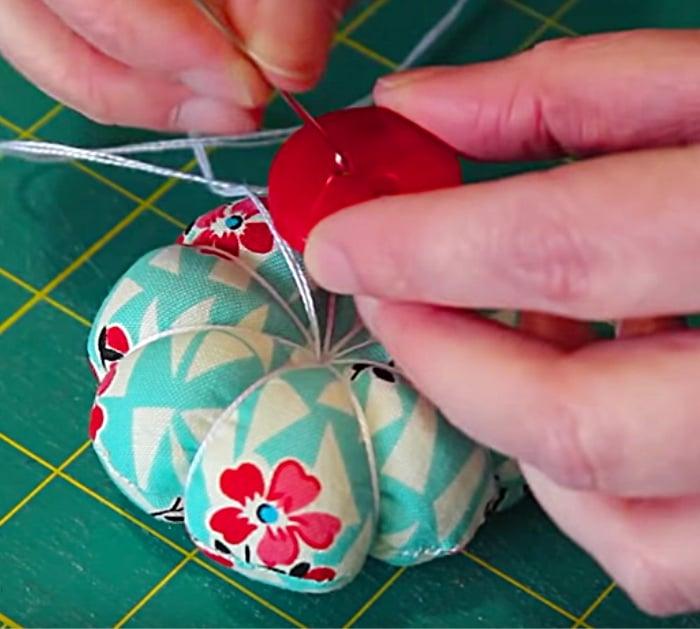 Learn to sew a DIY Petal Pincushion from fabric scraps and poly stuffing