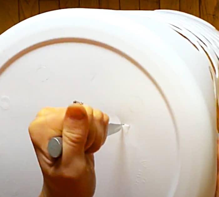Cut Holes In The Bottom Of A Laundry Basket To Grow Potatoes