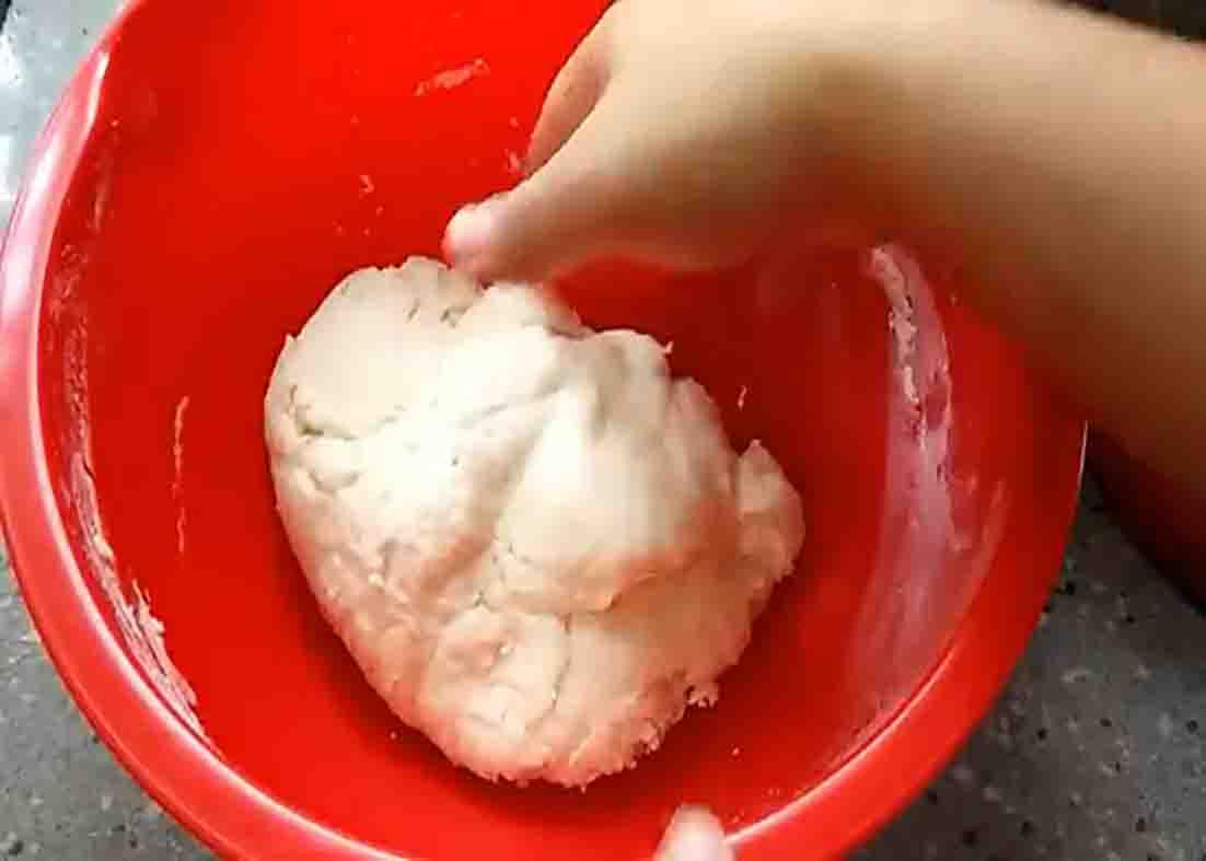 Kneading the dough to make the garlic cheese buns
