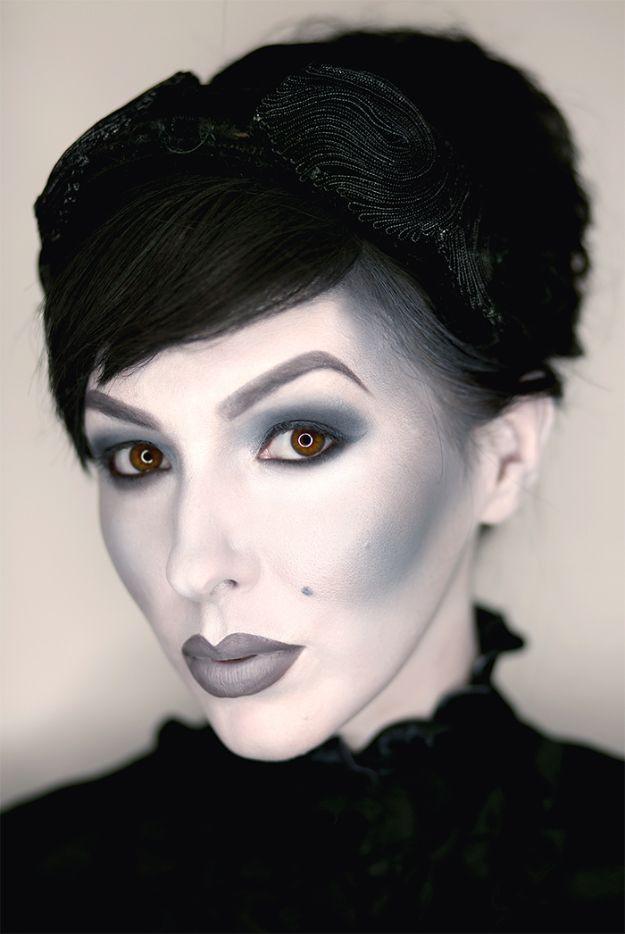 Black and white grayscale Halloween makeup with pale base, dark contoured cheeks and smoky gray eyes