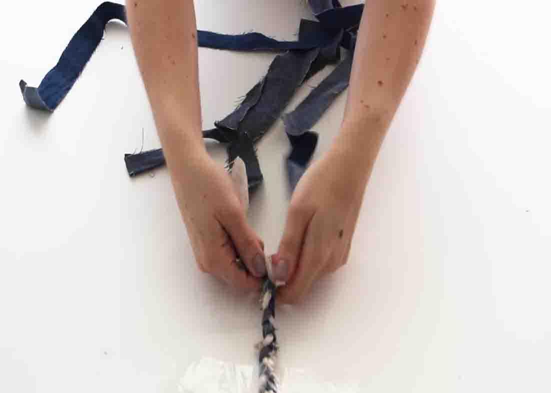 Braiding the fabric strips to make the basket