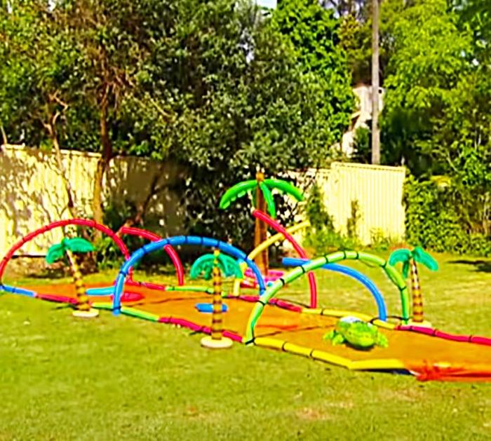 Decorate Your Monster Slip And Slide With Pool Noodle Soaking Arches And Blow Up Palm Trees