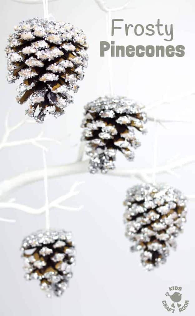 Pin graphic reading Frosty Pinecones, four pinecones dusted with white frost and glitter hanging from a white branch