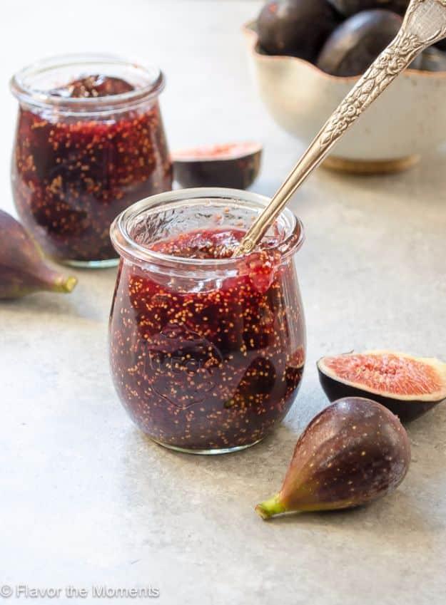 Small batch fig honey jam in a jar, made with fresh quartered figs, honey and vanilla, beside a cheese board