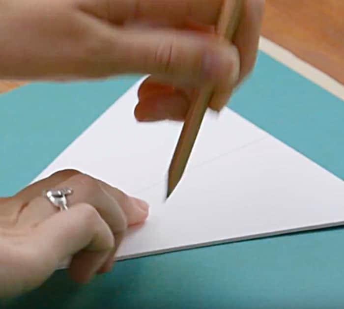 Learn to make a DIY flag garland from old wrapping paper