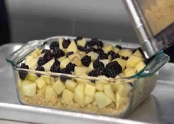 Assembling the apple-blackberry-betty dessert