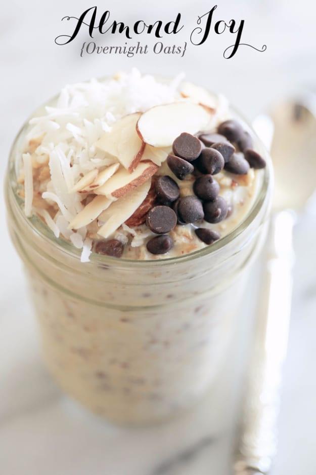 Almond Joy overnight oats in a jar with rolled oats, shredded coconut and mini chocolate chips stirred through