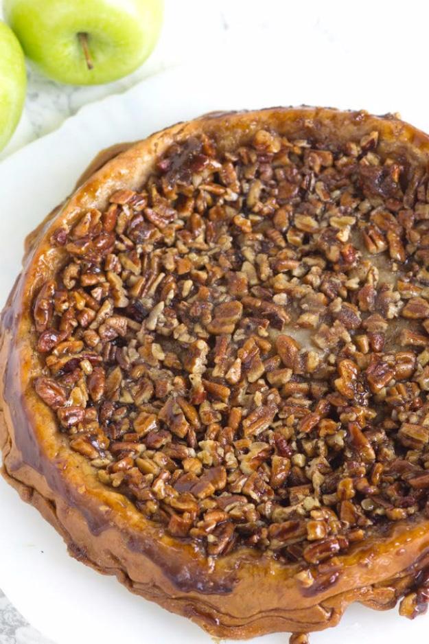 Upside down apple pecan pie turned out of the pan with a caramelized brown sugar and whole pecan topping