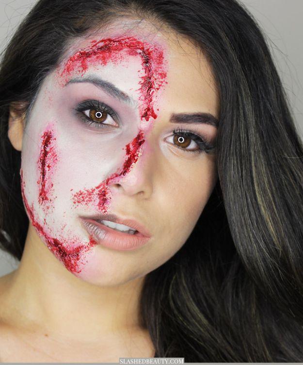 Half zombie Halloween makeup with torn skin effects on one side of the face and a clean smoky eye on the other