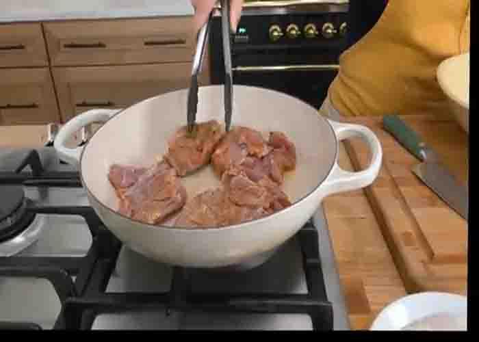 Frying the chicken for the creamy chicken and rice recipe