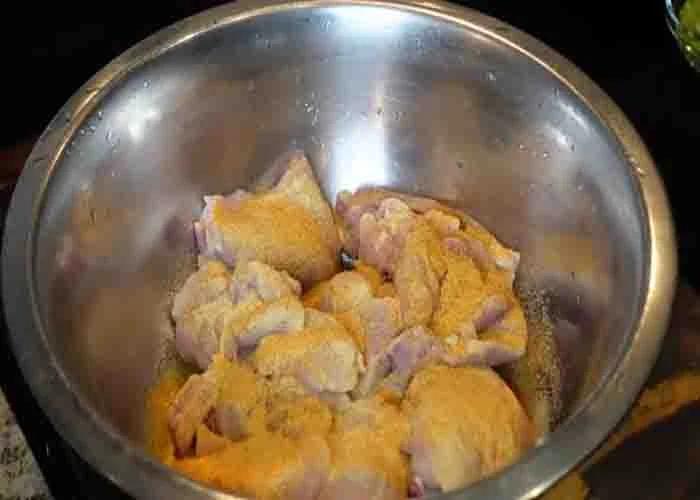 Seasoning the chicken to for the stewed chicken recipe