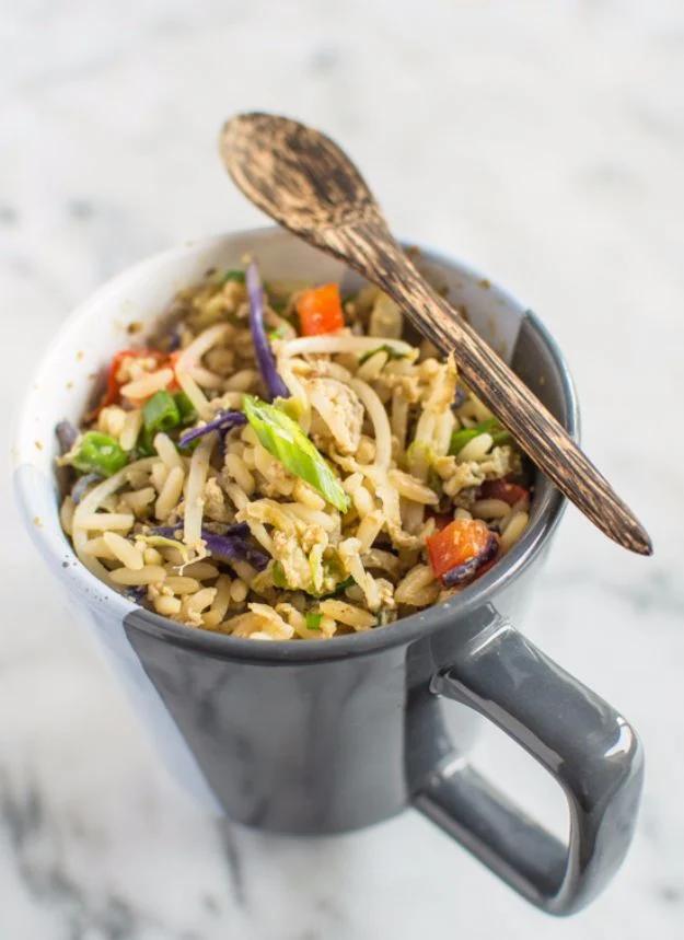 Egg fried rice in a mug with peas, red pepper and green onion, an easy dinner for one made in the microwave