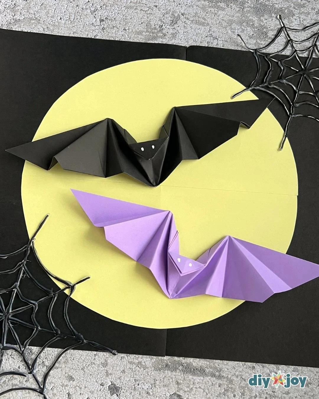 Origami bat folded from black paper for Halloween. The classic look for spooky Halloween decorations.