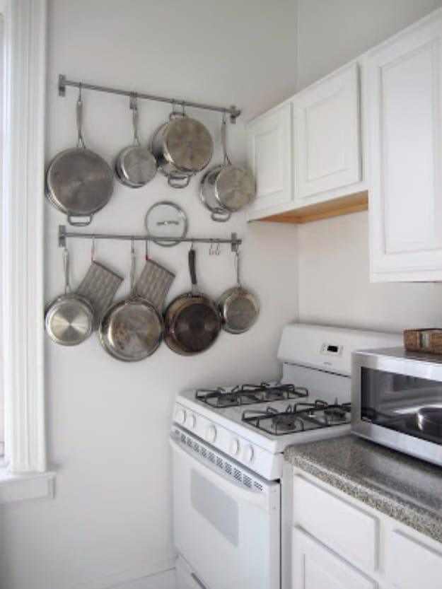Use Nifty Rails To Hang Pots And Pans, simple enough for anyone to do and a trick that actually works