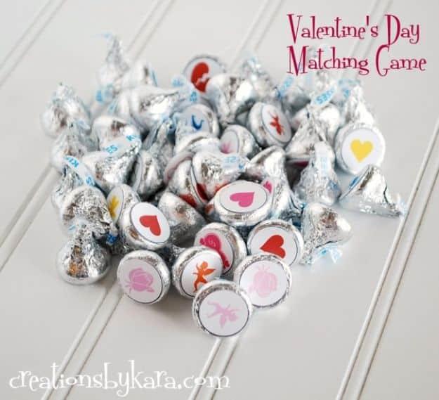 Valentines Day matching game with printable dots glued to the bottoms of foil wrapped Hershey's Kisses