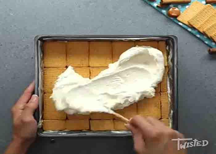 Assembling the caramel apple ice box cake