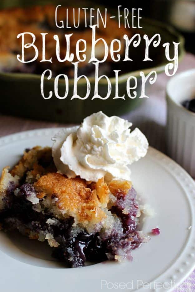 Gluten free blueberry cobbler in a baking dish with a golden drop biscuit topping and bubbling berries